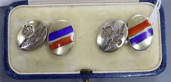 A cased pair of sterling and three colour enamel military related oval cufflinks.